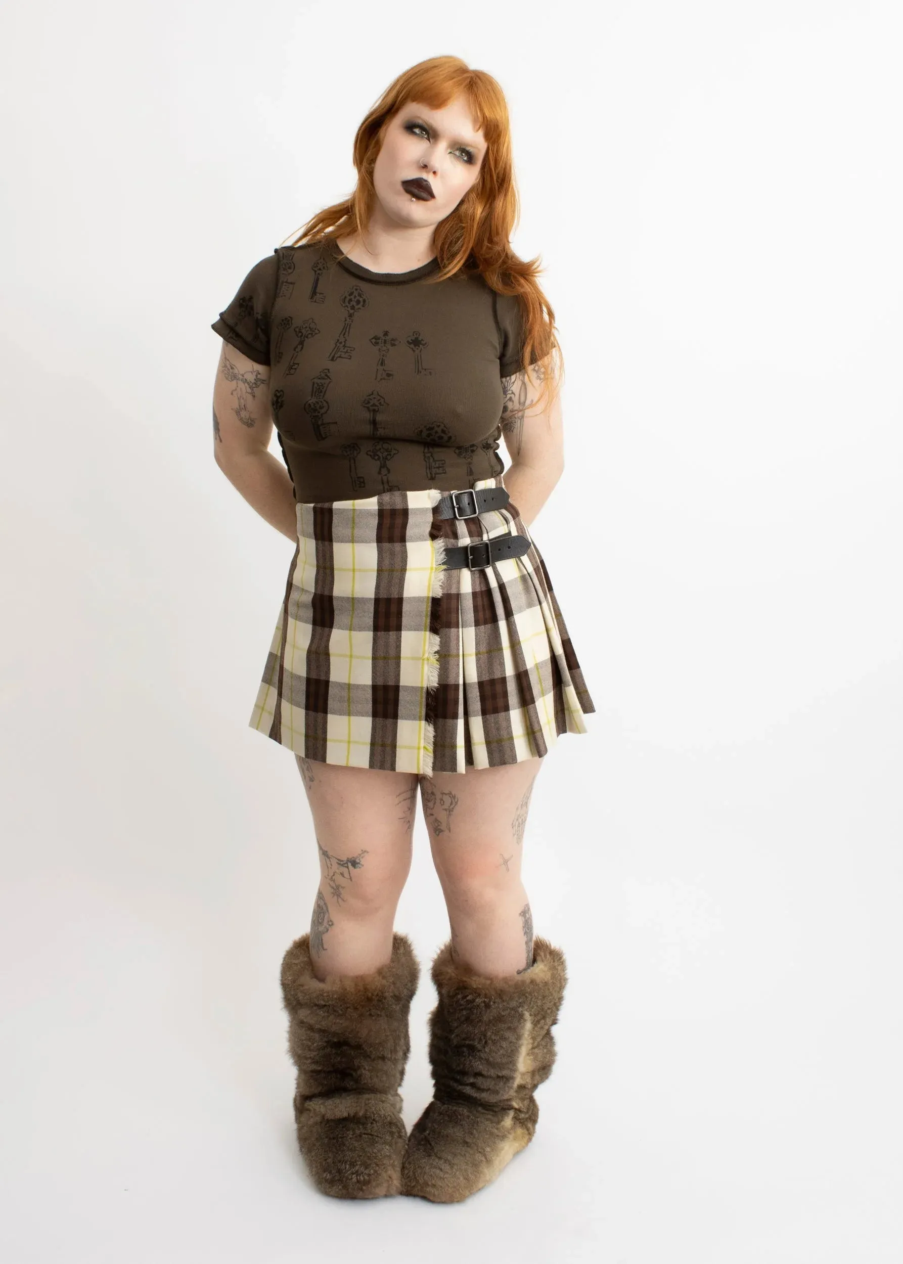 Tartan wool pleated mini skirt with leather buckles